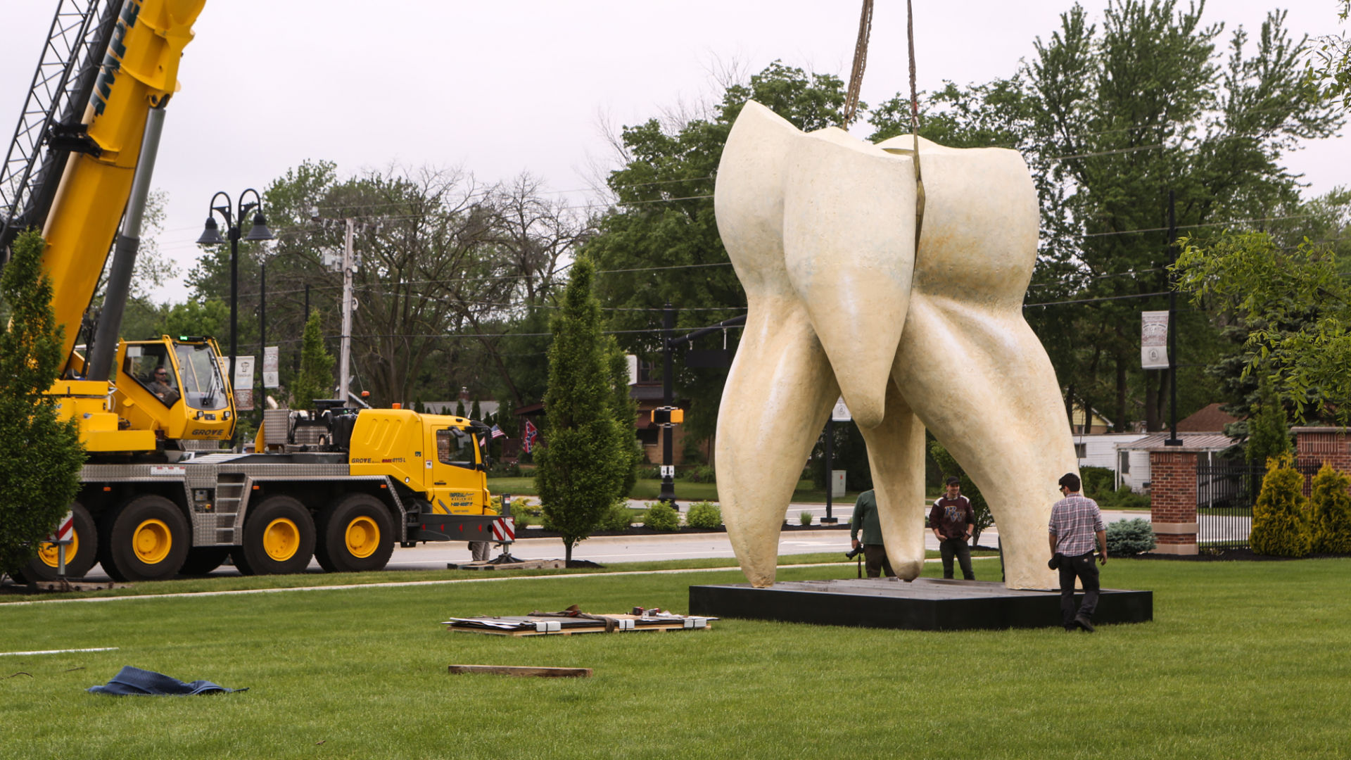 Artist Seward Johnson's "The Tooth" is implanted at the Crown Point Sportsplex